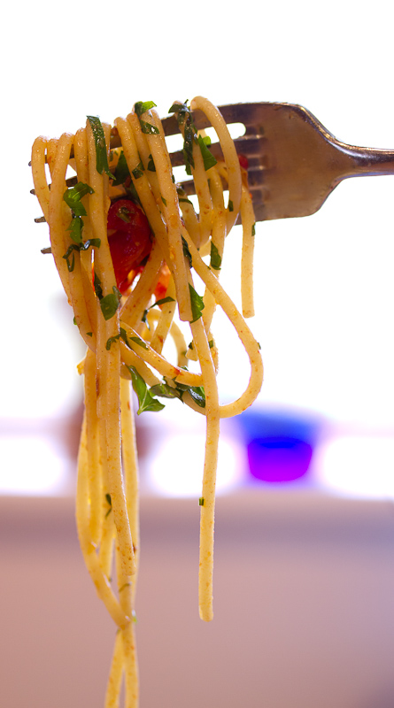 Pasta with grape tomatoes, colatura and garlic Pasta with grape tomatoes, colatura and garlic