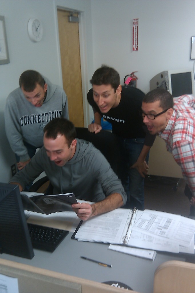 Excited Seveneers looking at new brochure