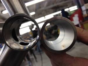 CNC threaded bottom bracket shell next to a blank