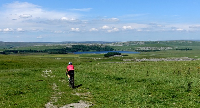 riding on the wide open plain to a lake