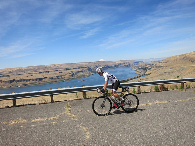 David Wilcox rides near a river