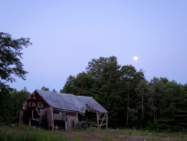 A dilapitated barn at dusk