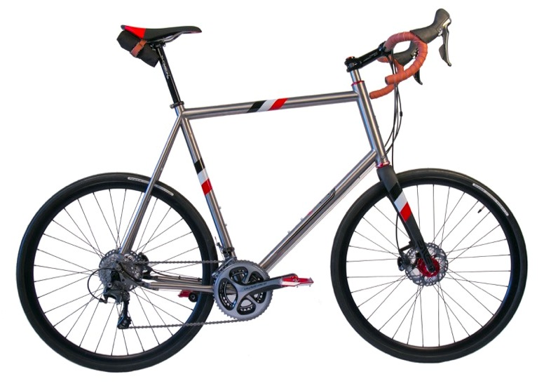 Seven Axiom SL, custom built for a rider of enormous stature, with black white and orange striped graphics