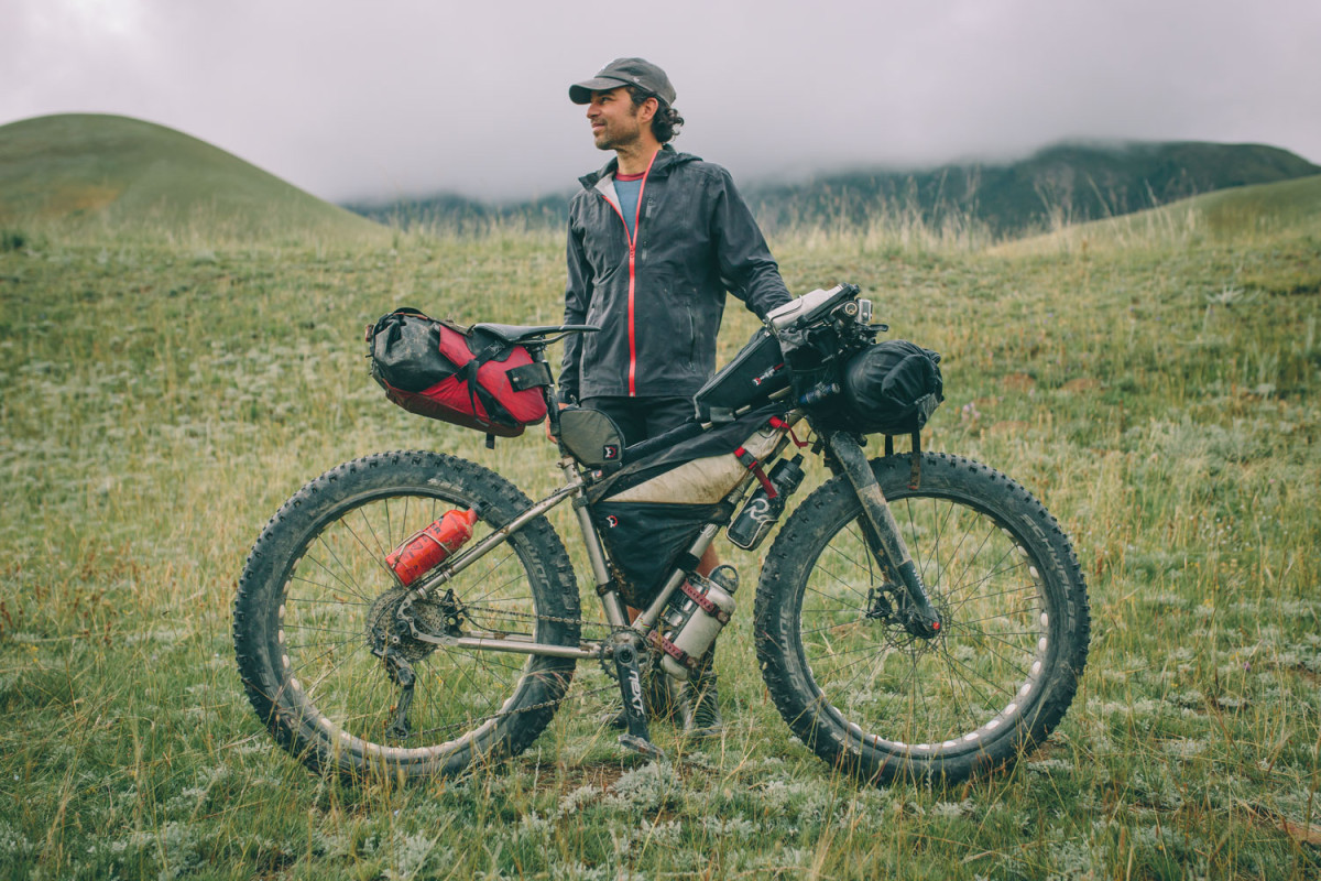 Joe Cruz proudly poses with his fully loaded bikepacking Seven Treeline SL