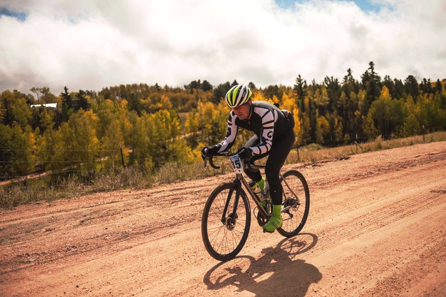 Mike hammers his Evegreen SL down a wide dirt road