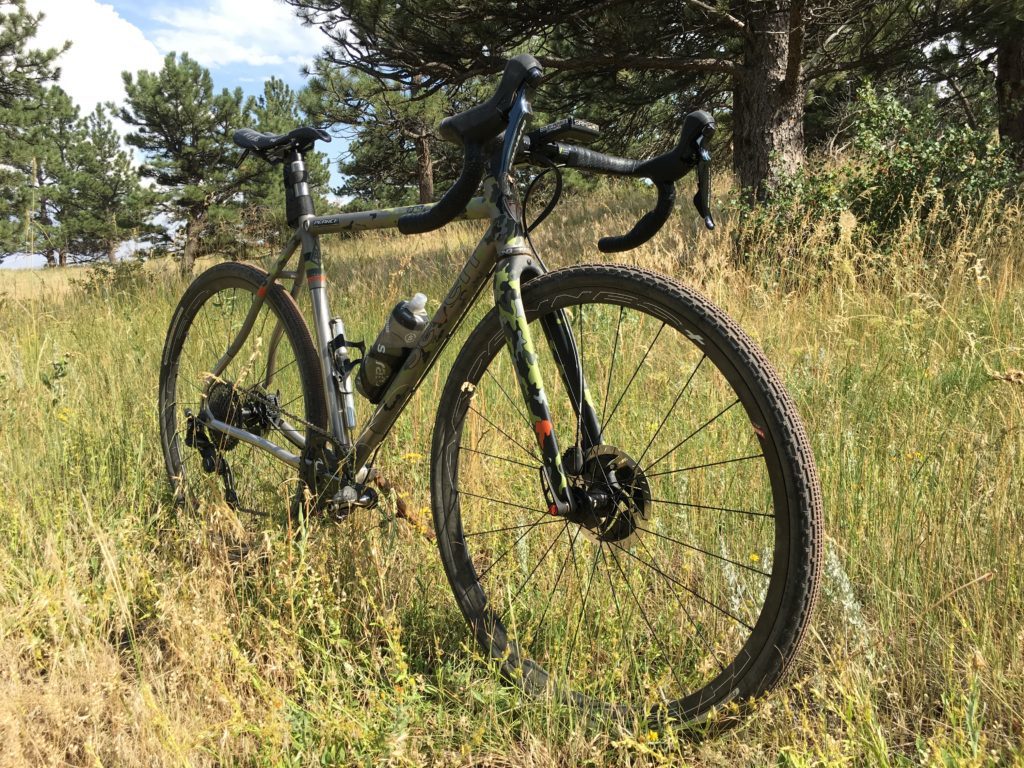 An Evergreem SLX with a stunning camoflagued paint job in agrassy field