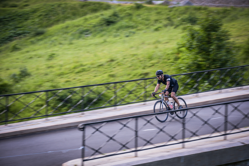 Omar speeds down a road on his Axiom SL
