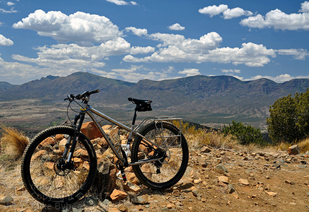 Seven Sola with custom racks on a rugged mountain road