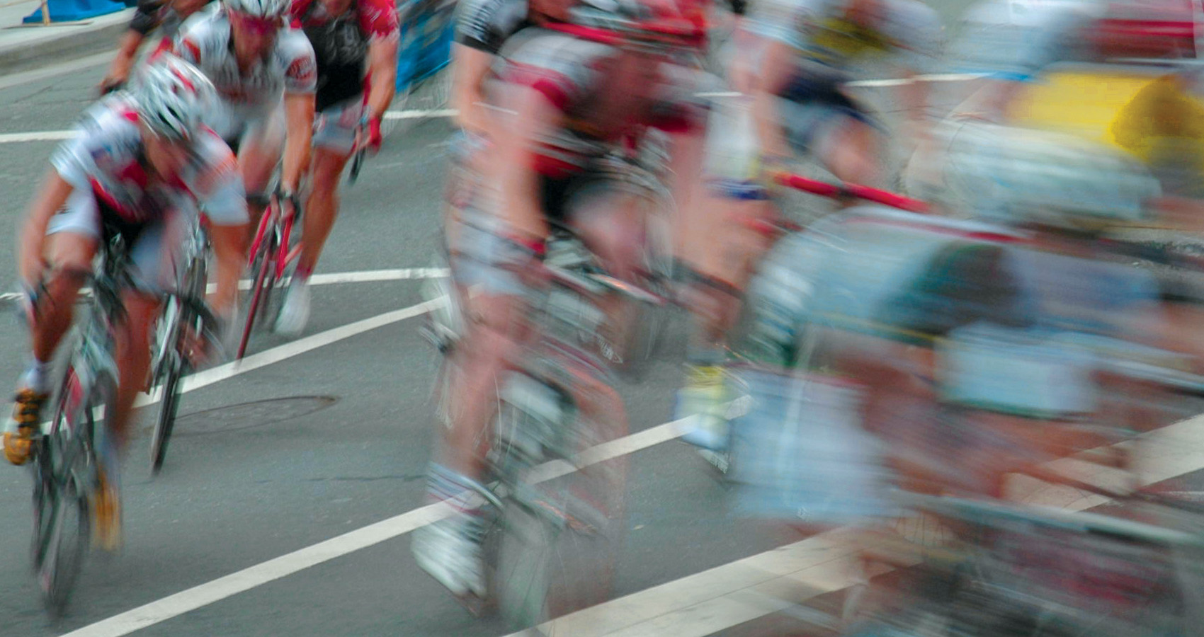 a pack of road cyclists in a race