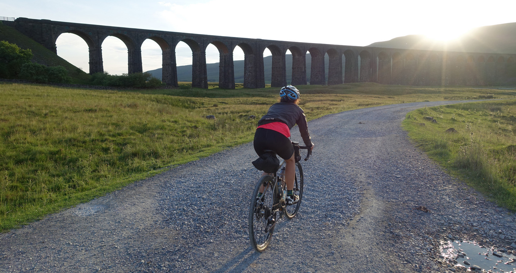 riding on gravel into the sunrise